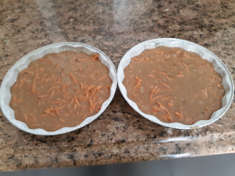 carrot cake batter poured into pans